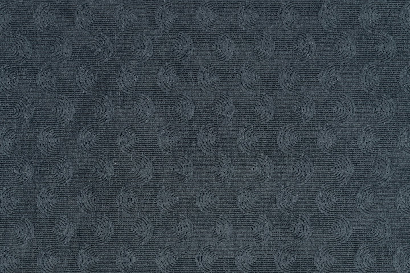 Dark blue-grey fabric with a repeating textured wave pattern.